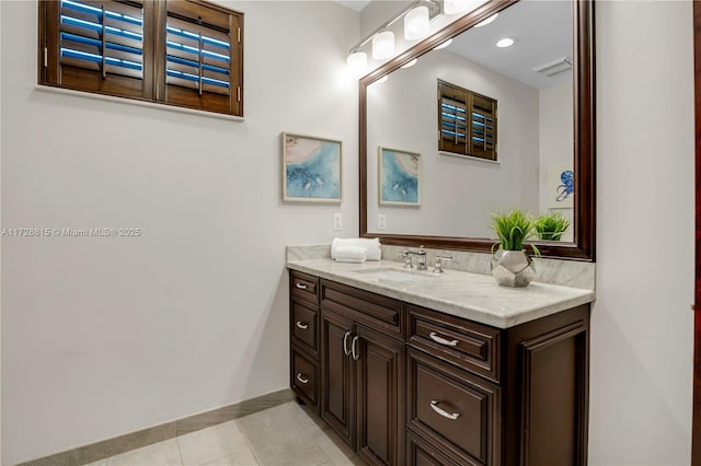 bathroom with tile patterned floors and vanity