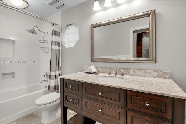 full bathroom featuring vanity, toilet, tile patterned flooring, and shower / tub combo