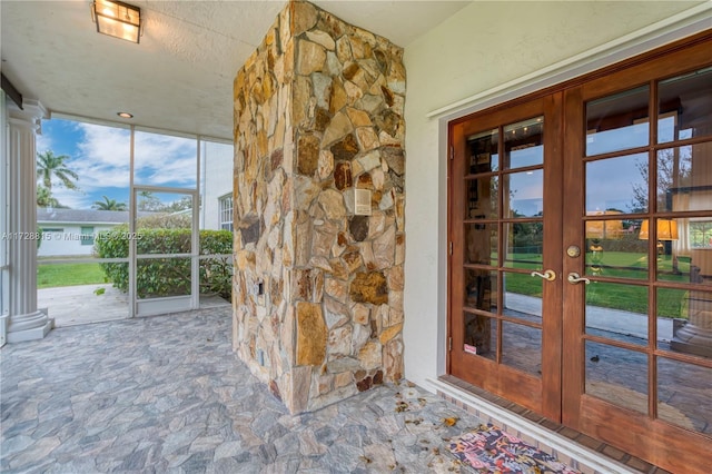 entrance to property featuring french doors