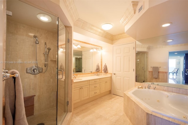 bathroom with vanity, ornamental molding, and separate shower and tub