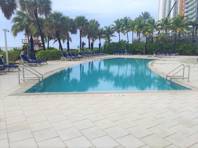 view of swimming pool with a patio area