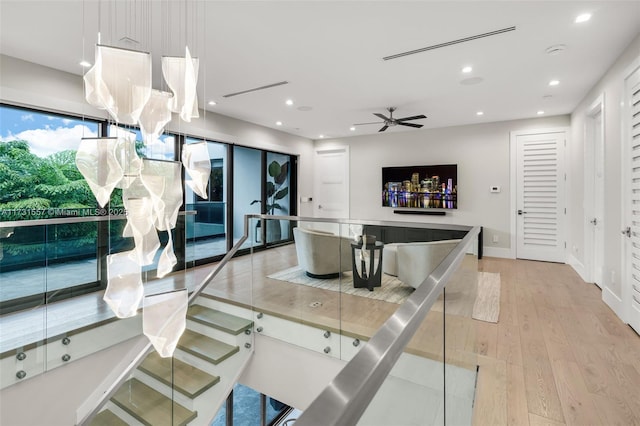 kitchen featuring ceiling fan and light wood-type flooring