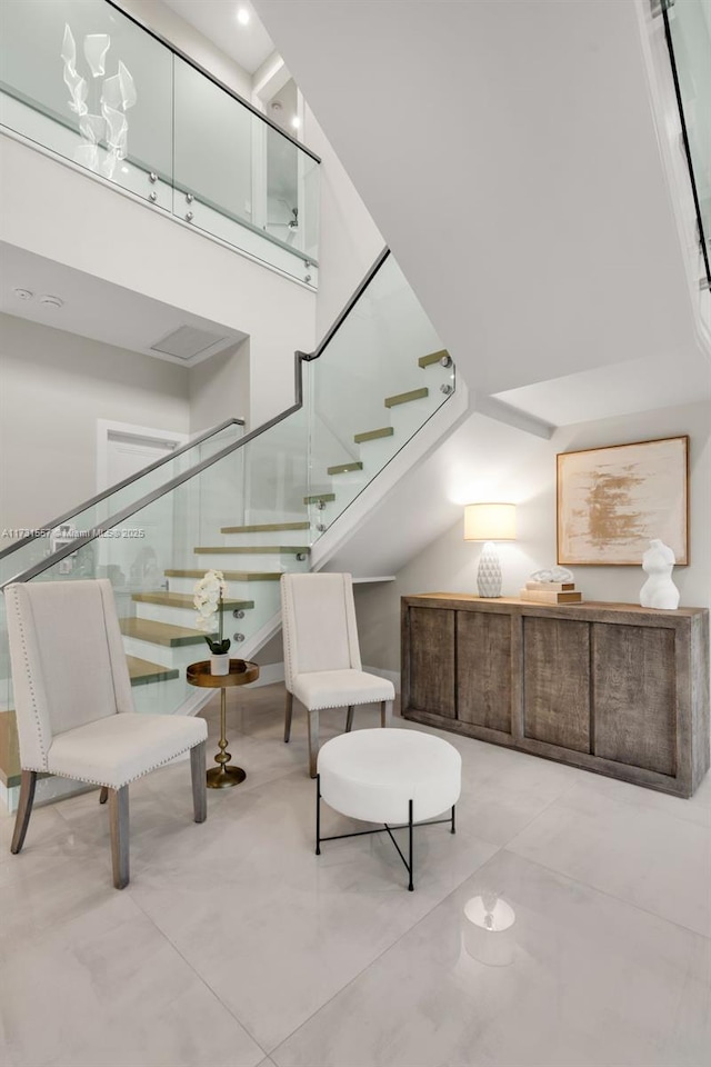 sitting room with a high ceiling