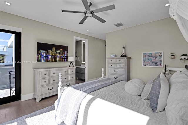 bedroom with ensuite bath, light hardwood / wood-style flooring, and ceiling fan