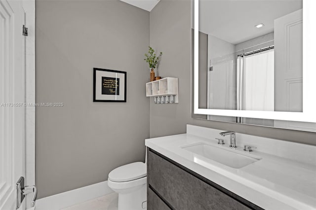 bathroom with vanity, toilet, and a shower with shower curtain