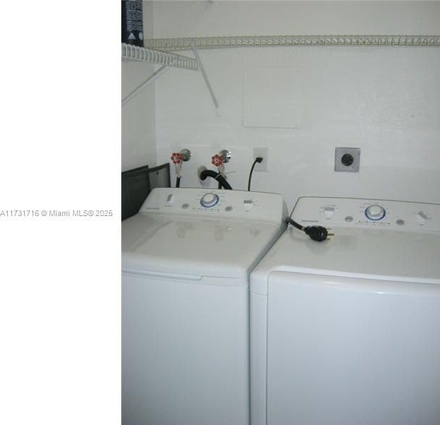 washroom with washer and dryer and laundry area