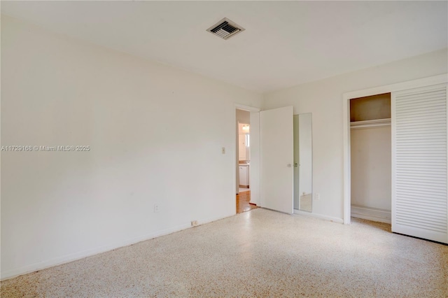 unfurnished bedroom with a closet