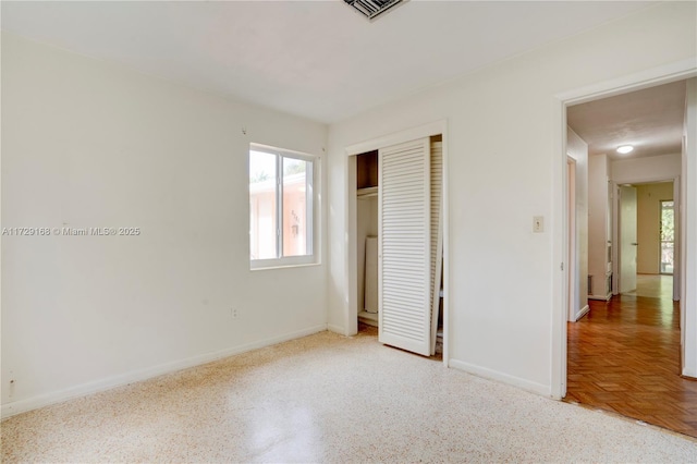 unfurnished bedroom with a closet