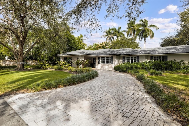 ranch-style house with a front yard