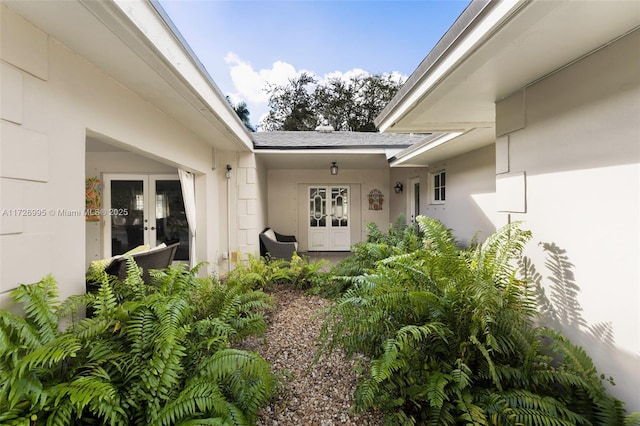 property entrance featuring french doors