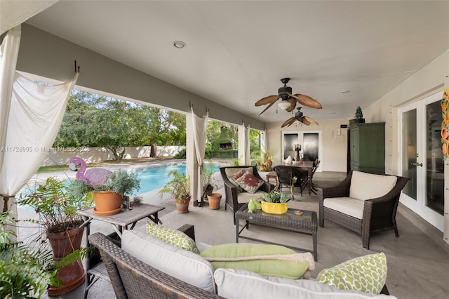 view of patio / terrace featuring a fenced in pool, an outdoor hangout area, ceiling fan, and french doors