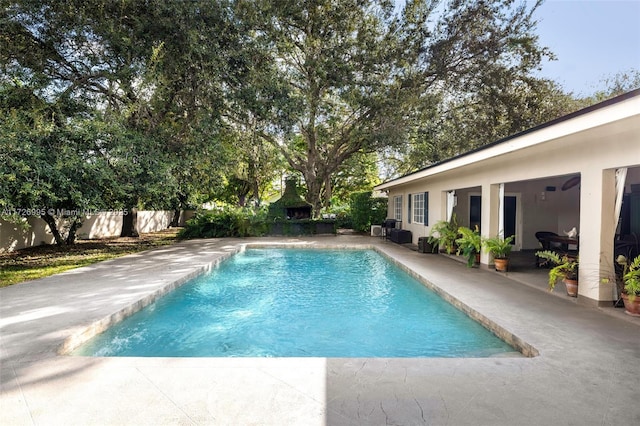 view of swimming pool with a patio area