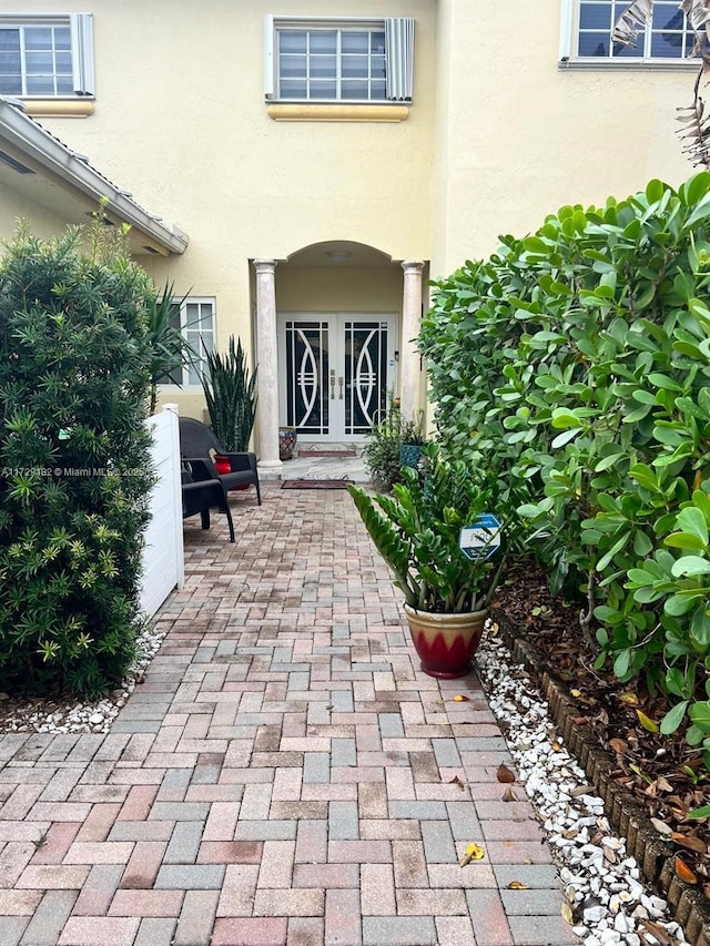 property entrance featuring french doors