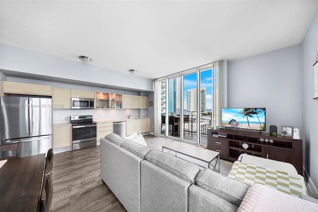 living room featuring hardwood / wood-style floors and floor to ceiling windows