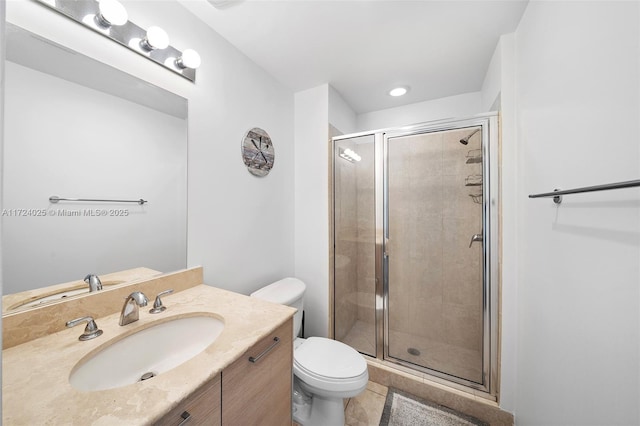 bathroom featuring vanity, tile patterned flooring, a shower with shower door, and toilet