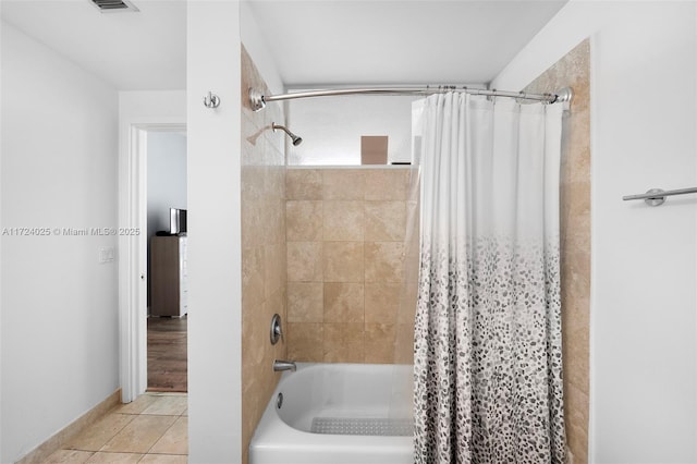 bathroom featuring shower / tub combo and tile patterned floors