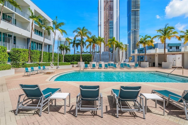 view of swimming pool featuring a patio area