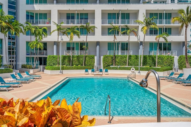 view of swimming pool with a patio area