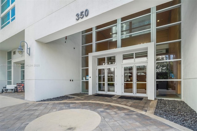 property entrance featuring french doors