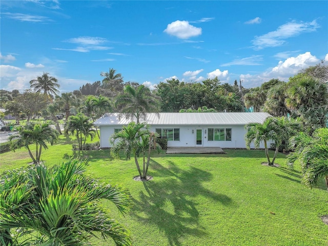 ranch-style home with a front yard