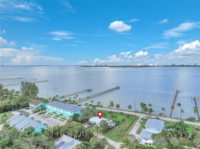 birds eye view of property with a water view