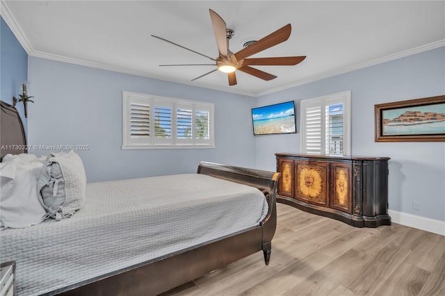 bedroom featuring light hardwood / wood-style flooring, ornamental molding, and ceiling fan