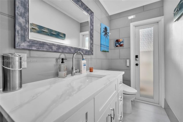 bathroom with vanity and toilet