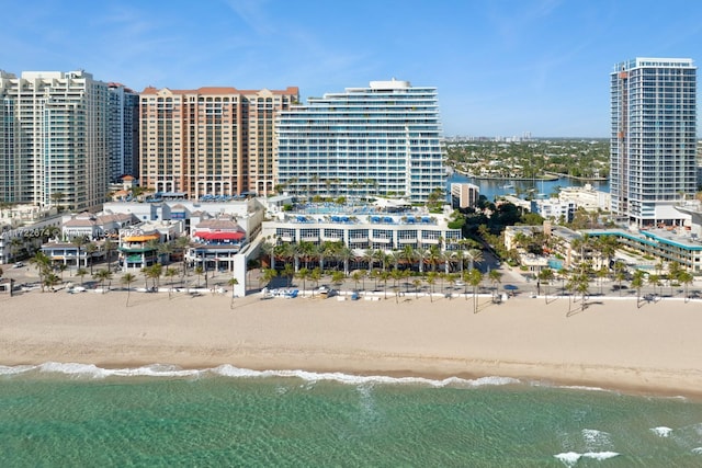 bird's eye view featuring a view of the beach and a water view