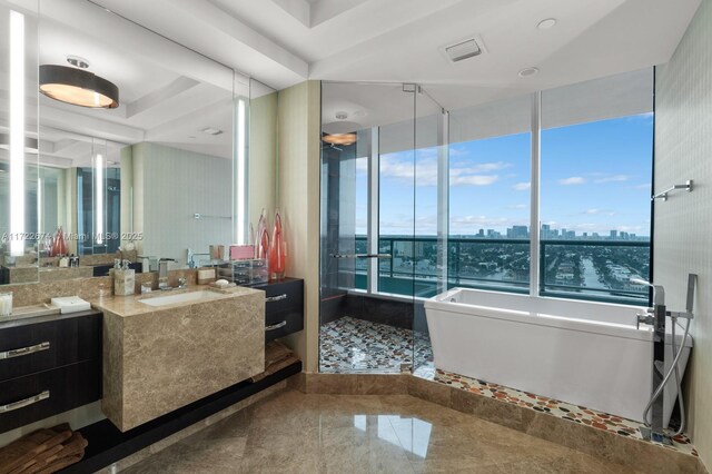 bathroom with vanity and a bath