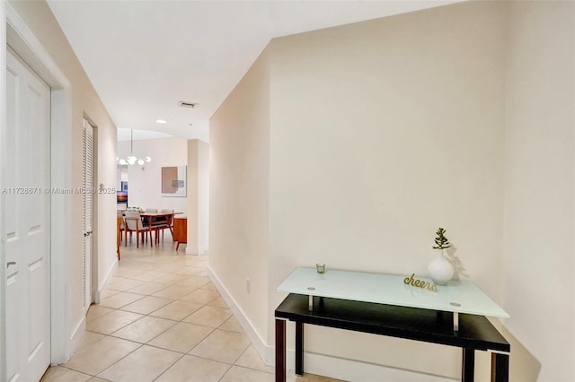 hall featuring light tile patterned flooring