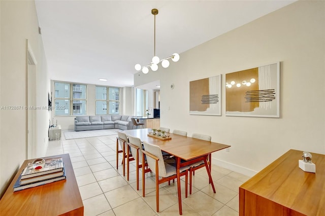 dining space featuring light tile patterned flooring