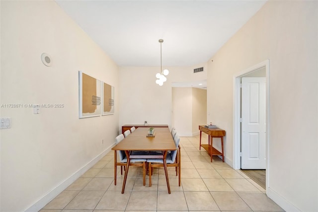 dining space featuring light tile patterned flooring