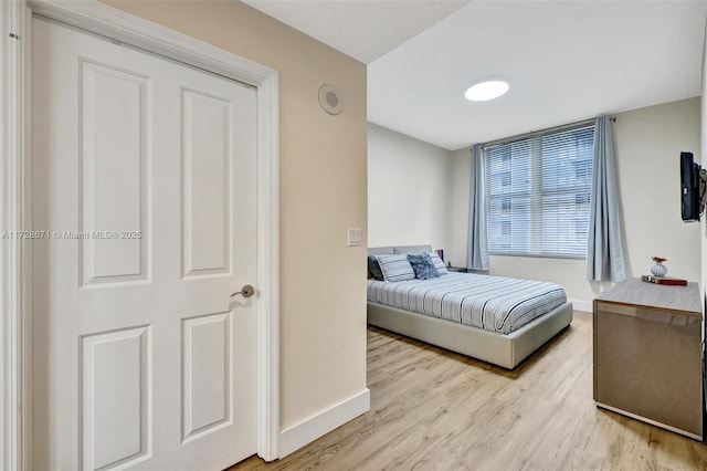 bedroom with light hardwood / wood-style floors