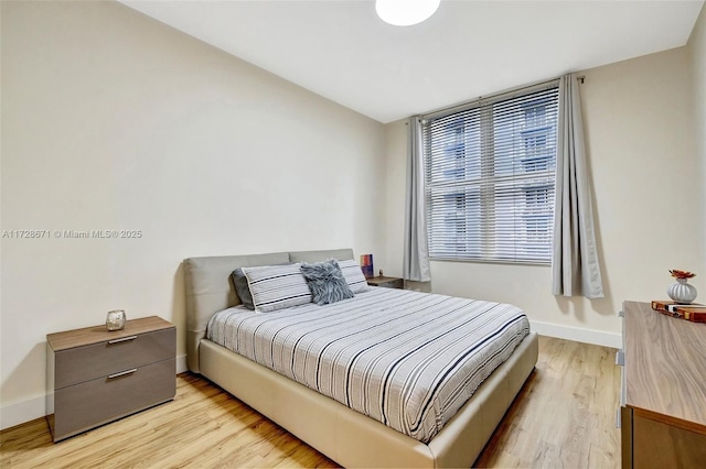 bedroom with light wood-type flooring