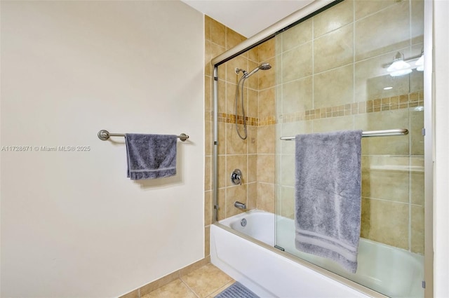 bathroom featuring tile patterned flooring and enclosed tub / shower combo