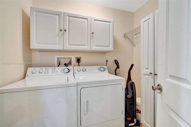 laundry area featuring cabinets and independent washer and dryer