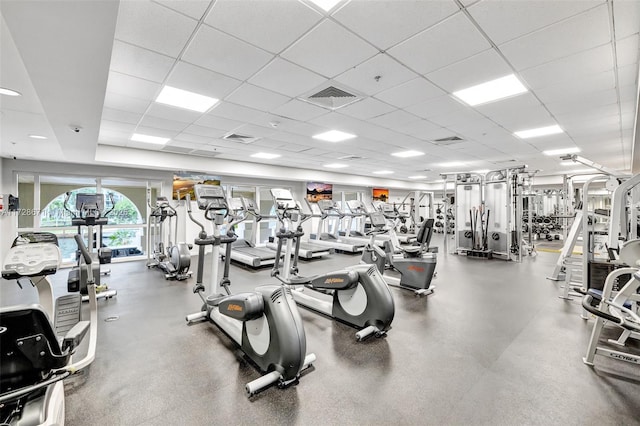 exercise room with a paneled ceiling