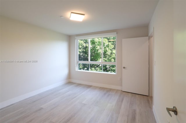 unfurnished room featuring light hardwood / wood-style floors