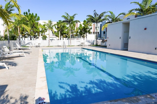 view of swimming pool featuring a patio area