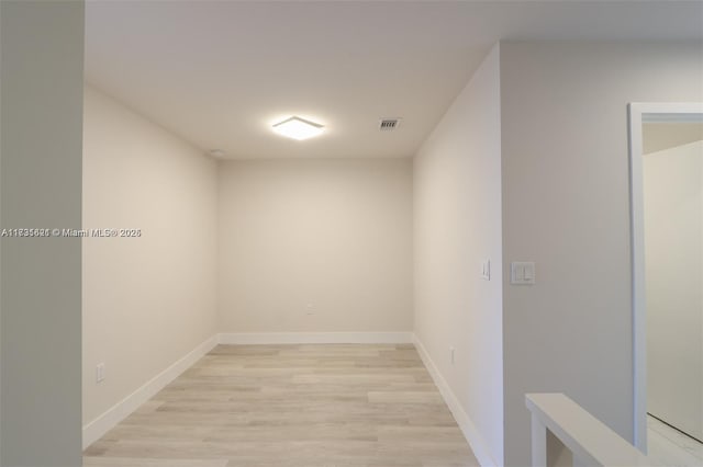 unfurnished room with light hardwood / wood-style flooring