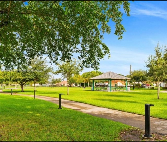 view of property's community featuring a gazebo and a lawn