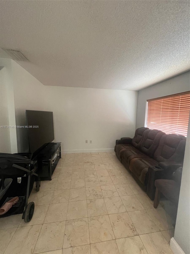 living room featuring a textured ceiling