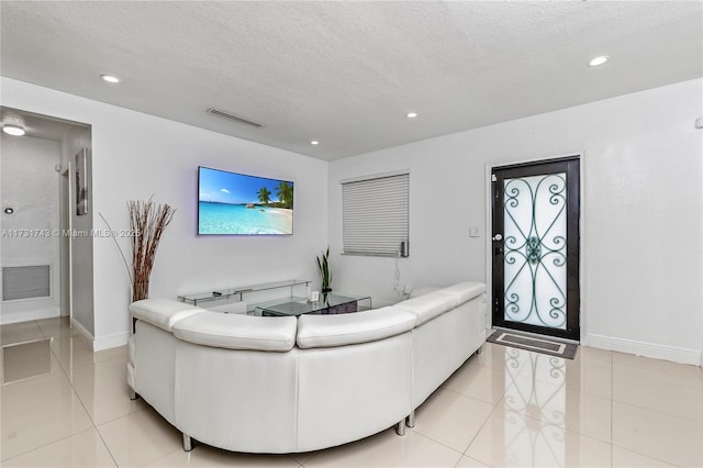 living room featuring a textured ceiling