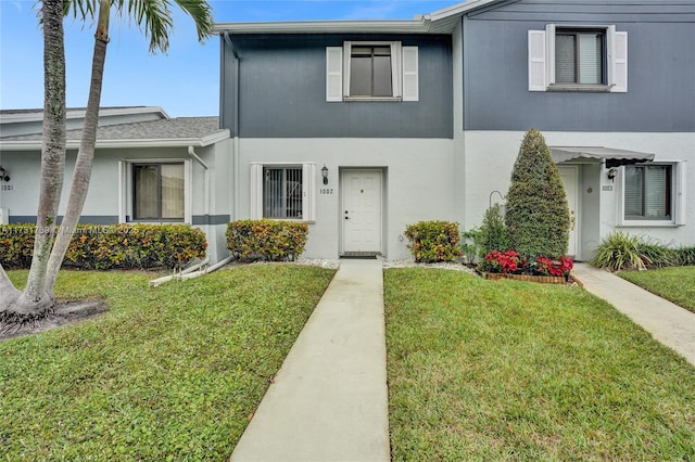 view of property with a front lawn