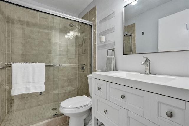 bathroom with vanity, an enclosed shower, and toilet