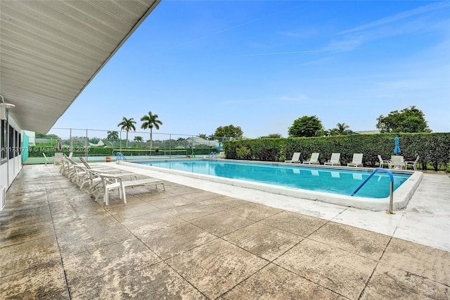 view of swimming pool with a patio