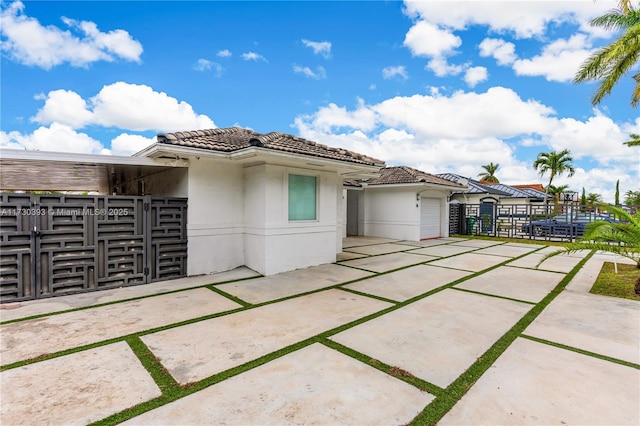 mediterranean / spanish home featuring a garage