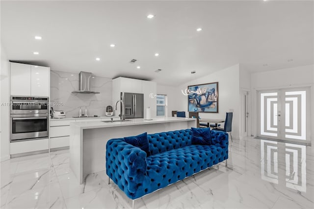 living room with vaulted ceiling and sink