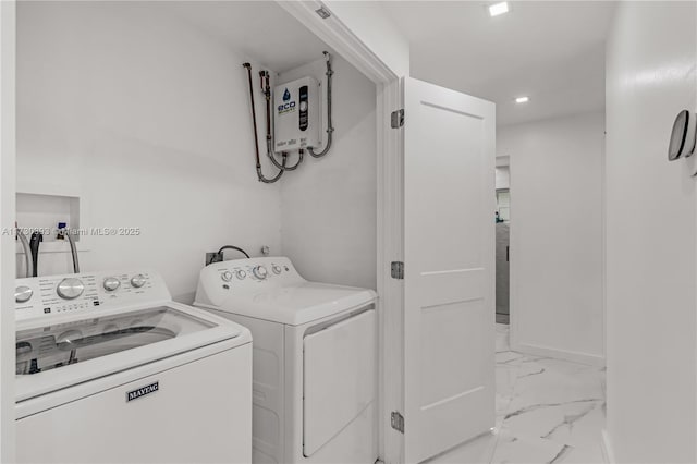 laundry area with independent washer and dryer