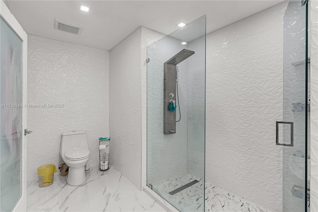 bathroom with walk in shower and toilet